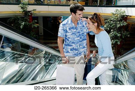 Couple in shopping center View Large Photo Image Stock Photograph - Couple in shopping center. Fotosearch