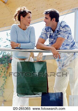 Couple in shopping center View Large Photo Image Stock Photography - Couple in shopping center. Fotosearch