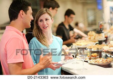 Couple in tapas bar, Basque Country, Spain View Large Photo Image Stock Image - Couple in tapas bar, Basque Country, Spain. Fotosearch