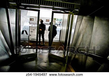Couple in the entrance to Caixa Forum building, Madrid, Spain. View Large Photo Image Stock Photo - Couple in the entrance to Caixa Forum building, Madrid, Spain.. Fotosearch