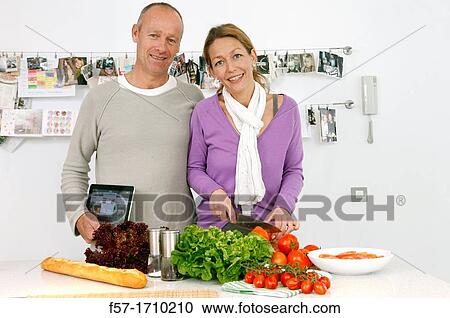 Couple in the kitchen View Large Photo Image Stock Image - Couple in the kitchen. Fotosearch