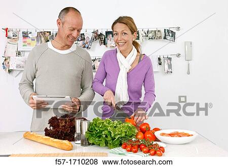 Stock Photo - Couple in the kitchen. Fotosearch