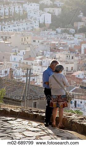 Stock Photo - Couple in the Medieval city of Tossa de Mar in the Costa Brava, Catalonia, Spain. Fotosearch