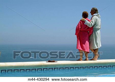 Couple in the swimming-pool. Javea. Alicante. Spain. View Large Photo Image Picture - Couple in the swimming-pool. Javea. Alicante. Spain.. Fotosearch