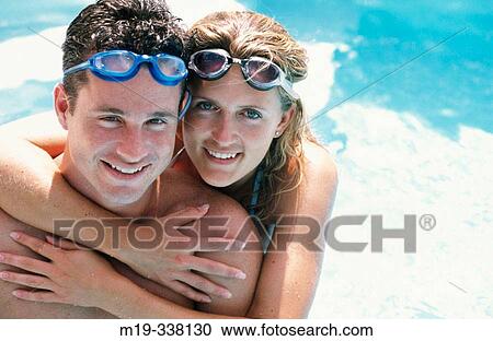 Couple in the swimming pool View Large Photo Image Stock Image - Couple in the swimming pool. Fotosearch