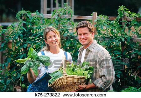 couple in vegetable garden View Large Photo Image Stock Image - couple in vegetable garden. Fotosearch