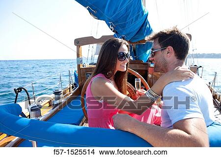 Couple in yacht View Large Photo Image Picture - Couple in yacht. Fotosearch