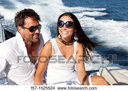 Couple in yacht View Large Photo Image Picture - Couple in yacht. Fotosearch