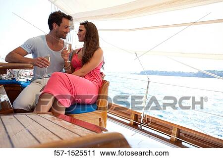 Stock Image - Couple in yacht. Fotosearch