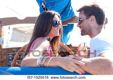 Couple in yacht View Large Photo Image Stock Photograph - Couple in yacht. Fotosearch