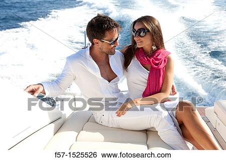 Couple in yacht View Large Photo Image Stock Photograph - Couple in yacht. Fotosearch