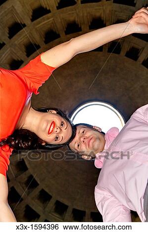 Stock Photograph - Couple inside the Roman Pantheon Rome Italy. Fotosearch