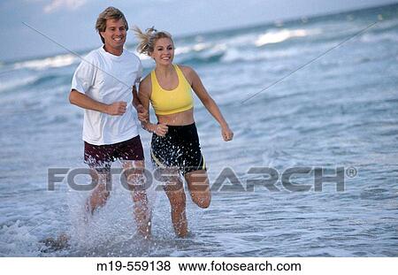 couple jogging on the beach View Large Photo Image Stock Photo - couple jogging on the beach. Fotosearch