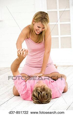 Couple joking at home View Large Photo Image Stock Image - Couple joking at home. Fotosearch