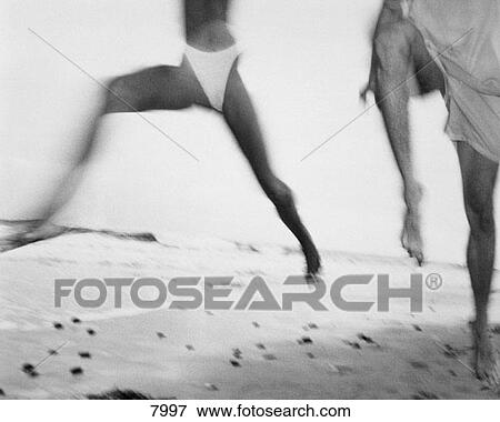 Couple jump for joy View Large Photo Image Stock Photo - Couple jump for joy. Fotosearch