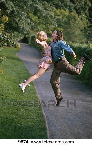 Picture - Couple jumping. Fotosearch