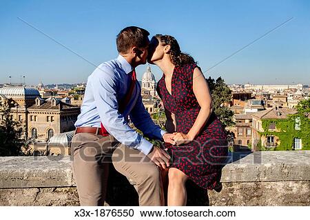 Stock Image - Couple kissing in the city of Rome Italy. Fotosearch