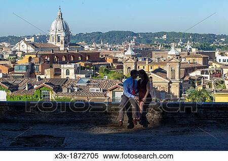 Couple kissing in the city of Rome Italy View Large Photo Image Stock Photography - Couple kissing in the city of Rome Italy. Fotosearch