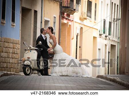 Couple kissing in the street View Large Photo Image Stock Photograph - Couple kissing in the street. Fotosearch