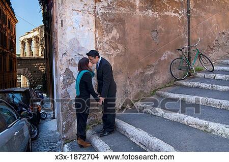 Couple kissing in the streets of Rome Italy View Large Photo Image Picture - Couple kissing in the streets of Rome Italy. Fotosearch