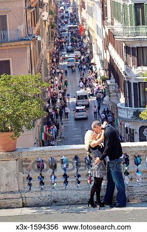 Stock Photograph - Couple kissing on the Spanish steps in Rome Italy. Fotosearch