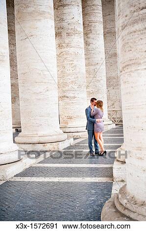 Couple kissing underneath the columns in Saint Peter's square Rome Italy View Large Photo Image Stock Image - Couple kissing underneath the columns in Saint Peter's square Rome Italy. Fotosearch