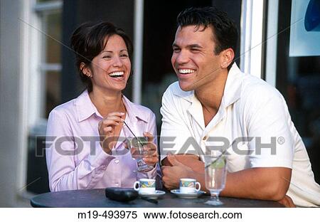 couple laughing at a cafe View Large Photo Image Stock Photography - couple laughing at a cafe. Fotosearch