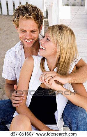 Couple laughing hand on hand View Large Photo Image Stock Photo - Couple laughing hand on hand. Fotosearch