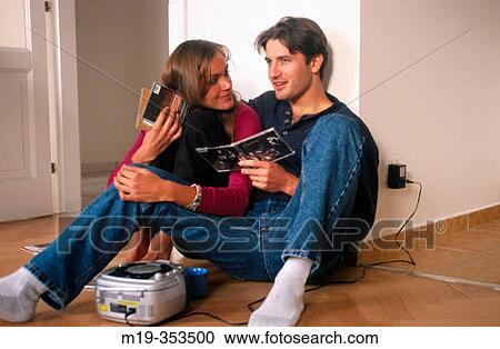 Couple listening to music View Large Photo Image Stock Image - Couple listening to music. Fotosearch