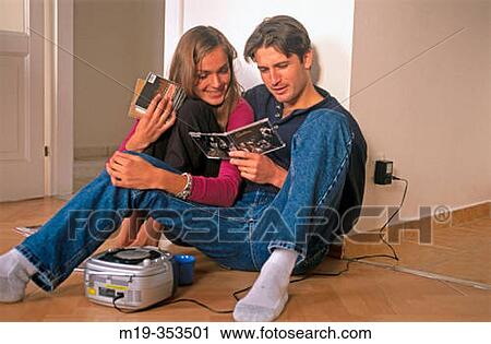 Couple listening to music View Large Photo Image Stock Image - Couple listening to music. Fotosearch