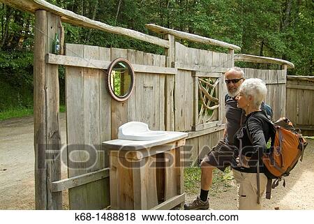 Stock Photo - couple look at outdoor sink on Salt Spring Island, BC, Canada. Fotosearch