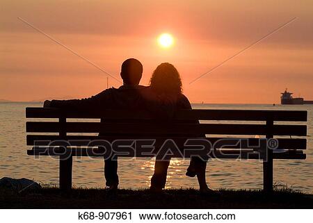 couple look at sunset over English Bay, Vancouver, BC, Canada View Large Photo Image Stock Image - couple look at sunset over English Bay, Vancouver, BC, Canada. Fotosearch