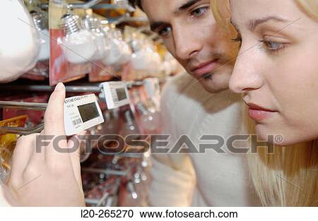 Couple looking at electronic price displays at Eroski shopping center. These displays are updated by remote control. Urbil. Usurbil. Guipuzcoa. Basque Country. Spain View Large Photo Image Stock Image - Couple looking at electronic price displays at Eroski shopping center. These displays are updated by remote control. Urbil. Usurbil. Guipuzcoa. Basque Country. Spain. Fotosearch