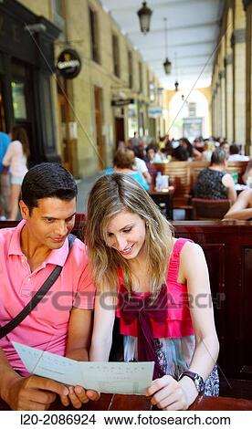 Picture - Couple looking at menu in the restaurant. San Sebastian. Donostia. Gipuzkoa. Basque Country. Spain.. Fotosearch