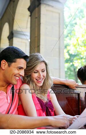 Couple looking at menu in the restaurant. San Sebastian. Donostia. Gipuzkoa. Basque Country. Spain. View Large Photo Image Picture - Couple looking at menu in the restaurant. San Sebastian. Donostia. Gipuzkoa. Basque Country. Spain.. Fotosearch