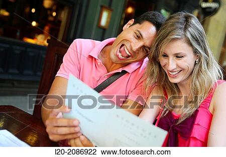Couple looking at menu in the restaurant. San Sebastian. Donostia. Gipuzkoa. Basque Country. Spain. View Large Photo Image Stock Image - Couple looking at menu in the restaurant. San Sebastian. Donostia. Gipuzkoa. Basque Country. Spain.. Fotosearch