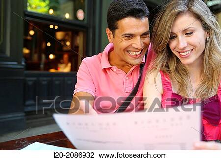 Couple looking at menu in the restaurant. San Sebastian. Donostia. Gipuzkoa. Basque Country. Spain. View Large Photo Image Stock Image - Couple looking at menu in the restaurant. San Sebastian. Donostia. Gipuzkoa. Basque Country. Spain.. Fotosearch