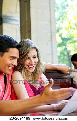 Couple looking at menu in the restaurant. San Sebastian. Donostia. Gipuzkoa. Basque Country. Spain. View Large Photo Image Stock Photo - Couple looking at menu in the restaurant. San Sebastian. Donostia. Gipuzkoa. Basque Country. Spain.. Fotosearch