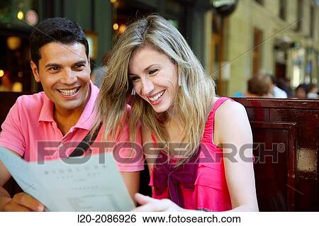 Couple looking at menu in the restaurant. San Sebastian. Donostia. Gipuzkoa. Basque Country. Spain. View Large Photo Image Stock Photograph - Couple looking at menu in the restaurant. San Sebastian. Donostia. Gipuzkoa. Basque Country. Spain.. Fotosearch