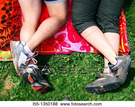 Couple lying on the grass. Spain. View Large Photo Image Stock Photo - Couple lying on the grass. Spain.. Fotosearch