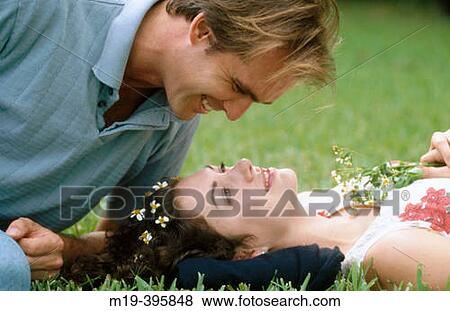couple lying on the grass View Large Photo Image Stock Photo - couple lying on the grass. Fotosearch