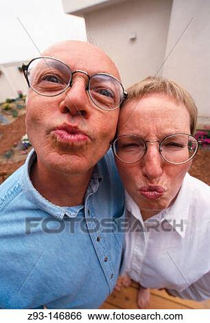 Couple make funny faces View Large Photo Image Stock Photograph - Couple make funny faces. Fotosearch