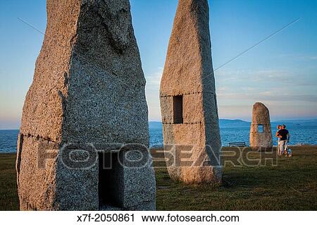 Stock Image - Couple, Menhires by Manolo Paz, Corua city, Galicia, Spain.. Fotosearch