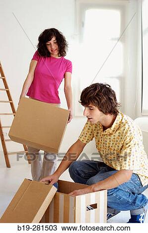 Couple moving home View Large Photo Image Stock Image - Couple moving home. Fotosearch