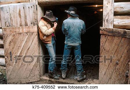 couple of cowboys by a barn View Large Photo Image Stock Image - couple of cowboys by a barn. Fotosearch