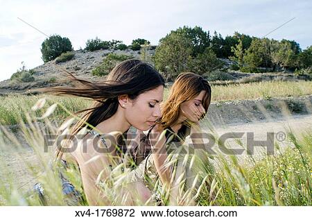 Couple of girls enjoyment in the countryside View Large Photo Image Stock Image - Couple of girls enjoyment in the countryside. Fotosearch