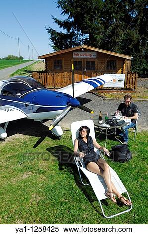 Couple of microlight plane Zenair 601 pilots preparing a flight, Belgium View Large Photo Image Stock Photography - Couple of microlight plane Zenair 601 pilots preparing a flight, Belgium. Fotosearch