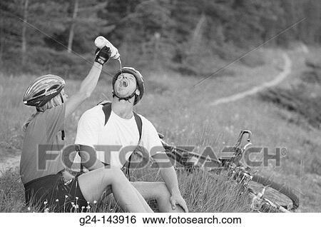 Couple of mountain bikers View Large Photo Image Stock Photograph - Couple of mountain bikers. Fotosearch