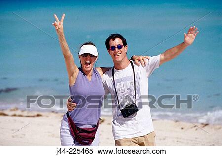 Couple of tourists at the beach. Miami Beach. Florida. USA View Large Photo Image Stock Photography - Couple of tourists at the beach. Miami Beach. Florida. USA. Fotosearch