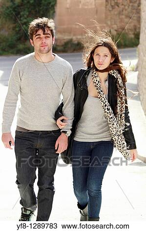 Couple of young walkers View Large Photo Image Stock Image - Couple of young walkers. Fotosearch